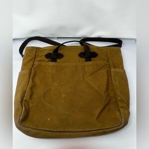 Filson canvas tote with leather straps.